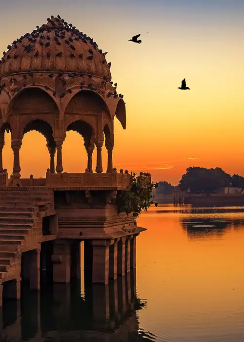 Ancient temple ruins at Gadi Sagar lake Jaipur Rajasthan at sunrise