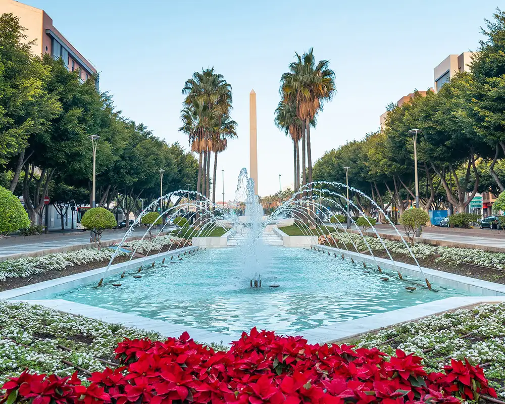 A View of a Fountain surrounded by trees in Almeria, Spain