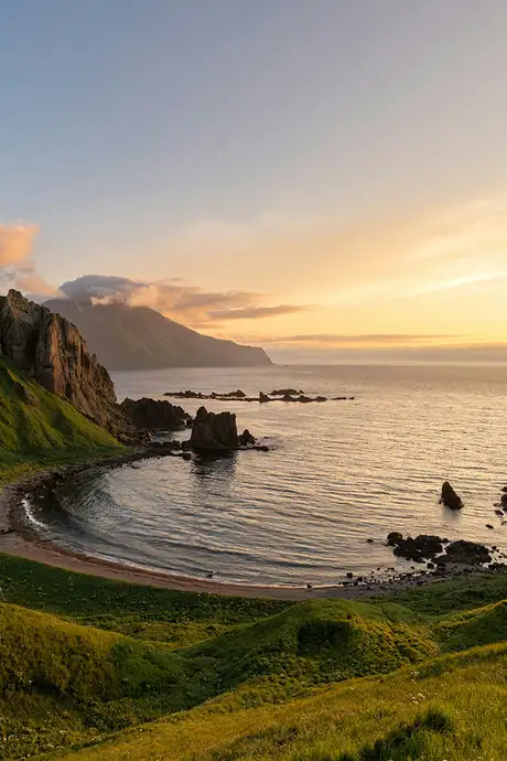 The sunset over the coast of the island of Adak, Alaska