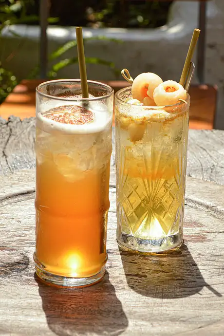 Two Cocktails served at a bar
