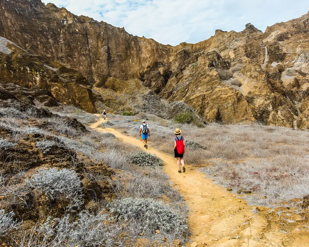 People walking a trail at the top of Punta Pitt in the Galapagos Islands
