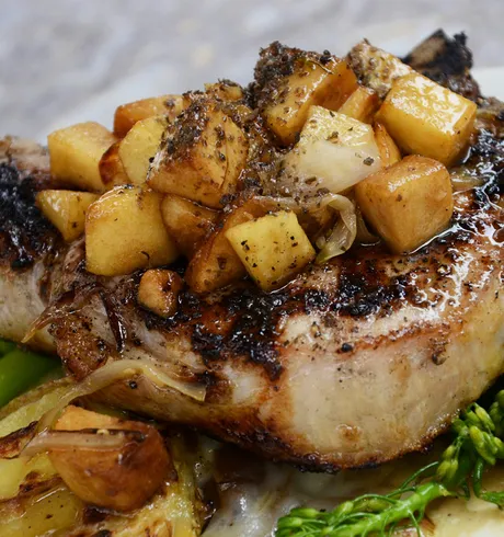 A dish made of Pork, Potatoes, and broccoli