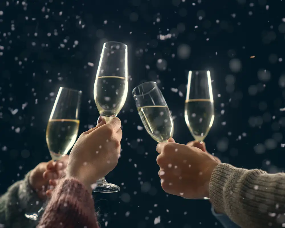 A group of friends cheering champagne