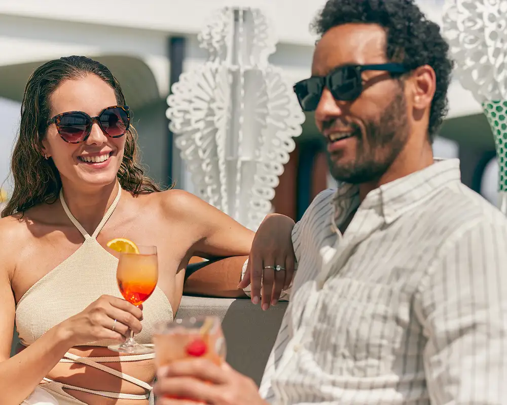 A Couple Enjoying drinks on a Celebrity Ship