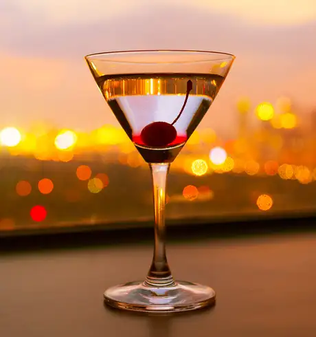 A Cocktail with a Cherry in the drink