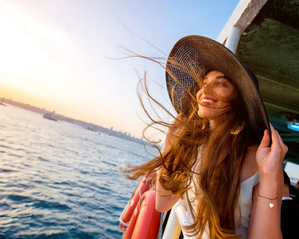 A woman riding a ferry in Istanbul