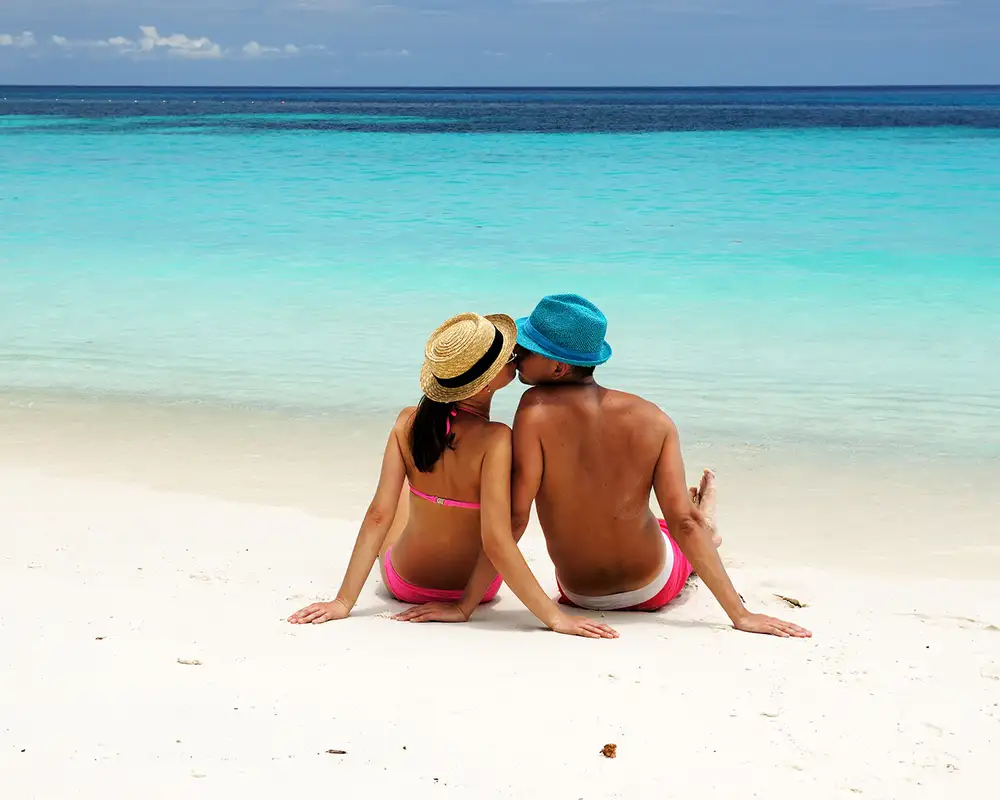 A Couple kissing on a beach