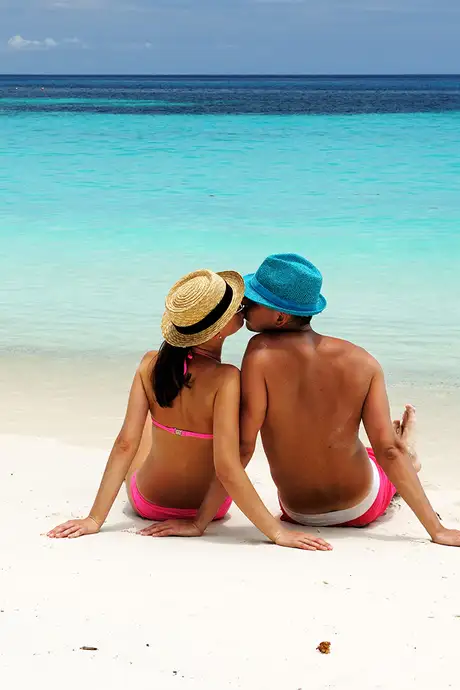 A Couple kissing on a beach