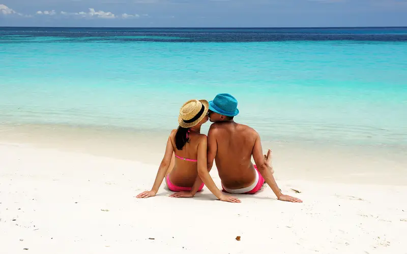 A Couple kissing on a beach