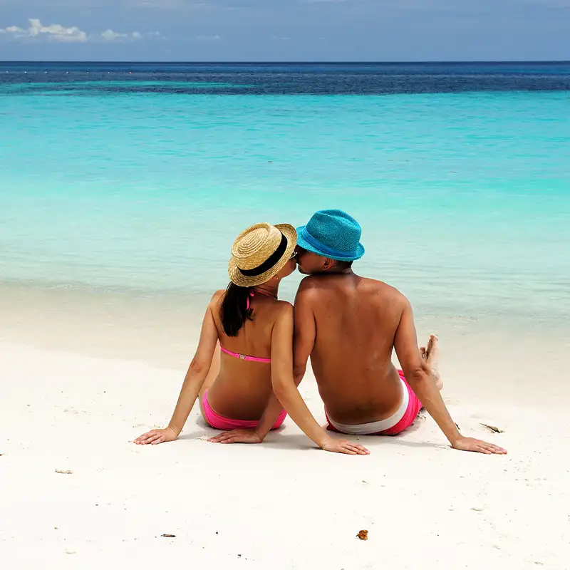 A Couple kissing on a beach