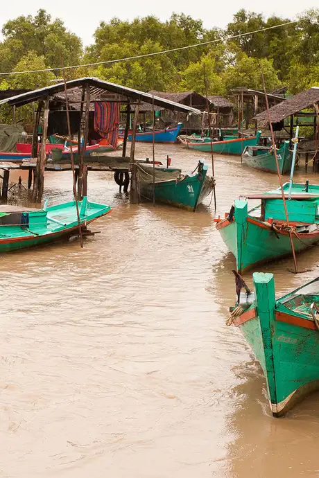 A group of fishing boats in a river in Cambidia