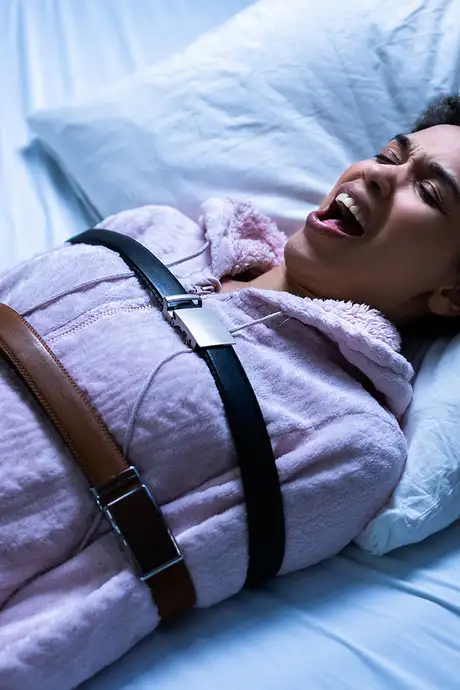 Someone suffering with sleep paralysis