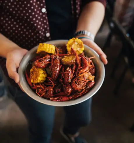 Shrimp and corn cooked in a Cajun style