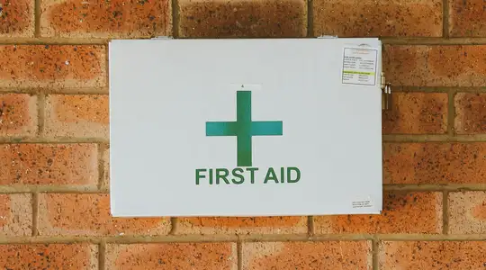 A First Aid Kit Mounted on a Wall