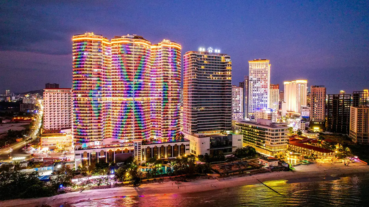 Buildings lit up at night in Sihanoukville, Cambodia