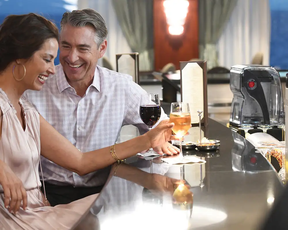 A Couple at a restaurant aboard an Oceania Ship