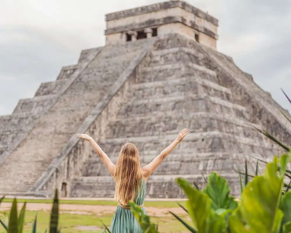 A woman standing outside of an Aztec Temple