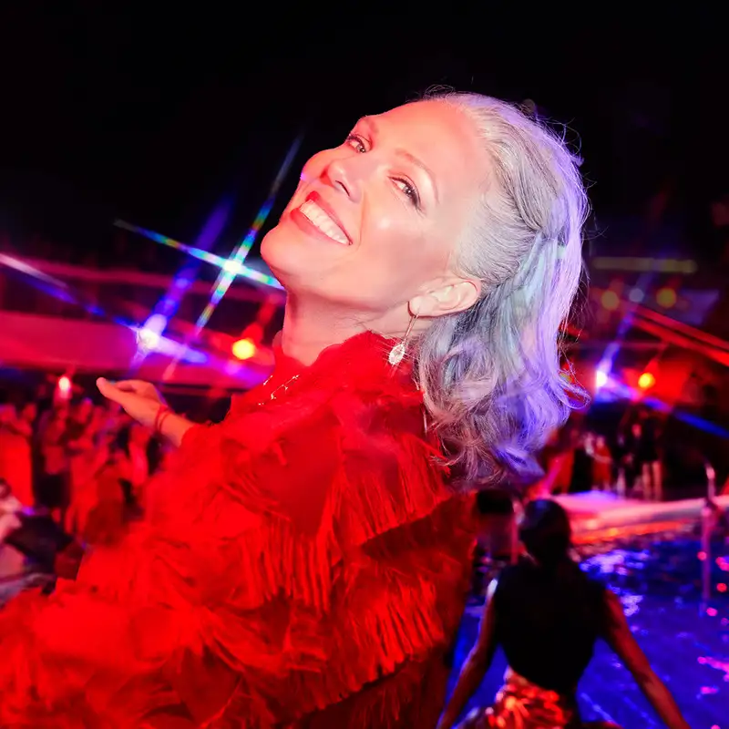 A woman taking part in the Scarlet Night Party aboard Virgin Voyages