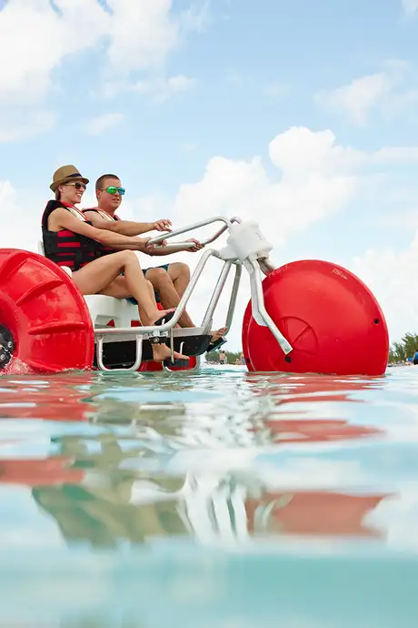A Couple riding a water bike