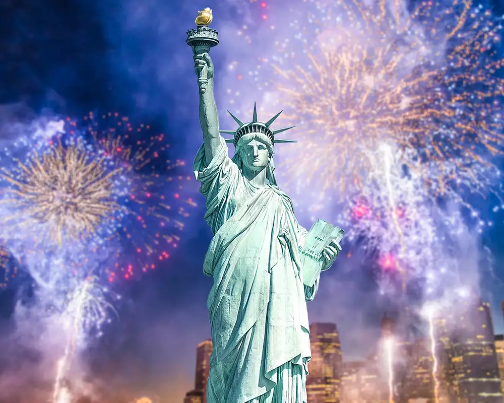The Statue of Liberty in front of fireworks