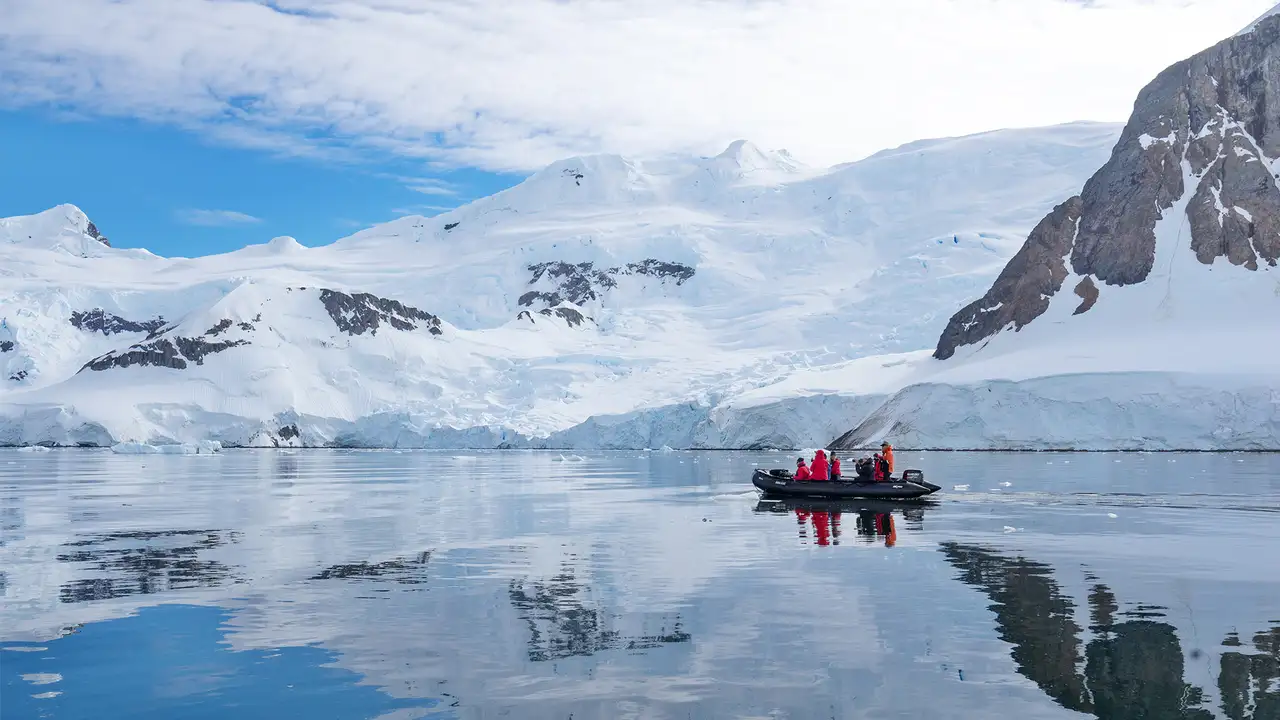 A group of explorers on an expedition of Antarctica on a boat
