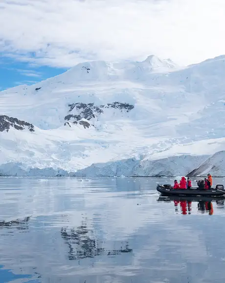 A group of explorers on an expedition of Antarctica on a boat