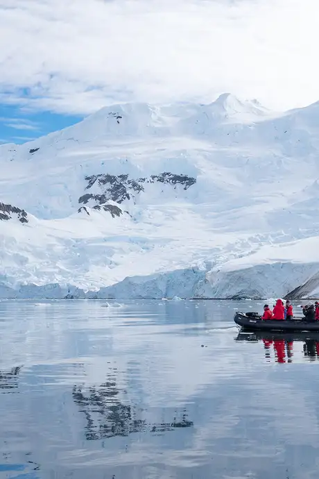 A group of explorers on an expedition of Antarctica on a boat