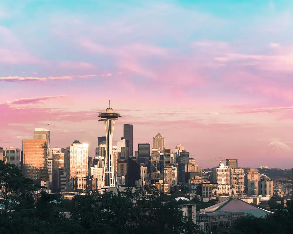 The skyline of Seattle with a pink sky