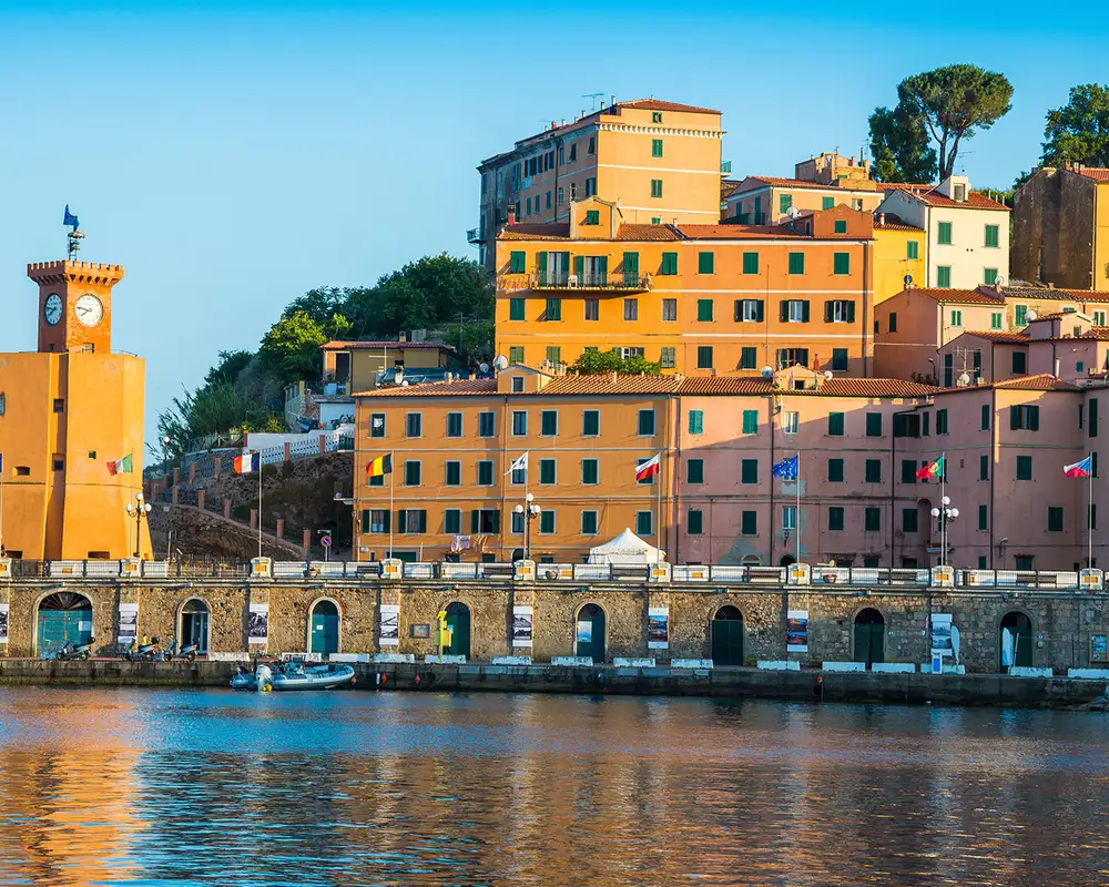 A View of waterfront buildings and a clocktower in Livorno, Italy