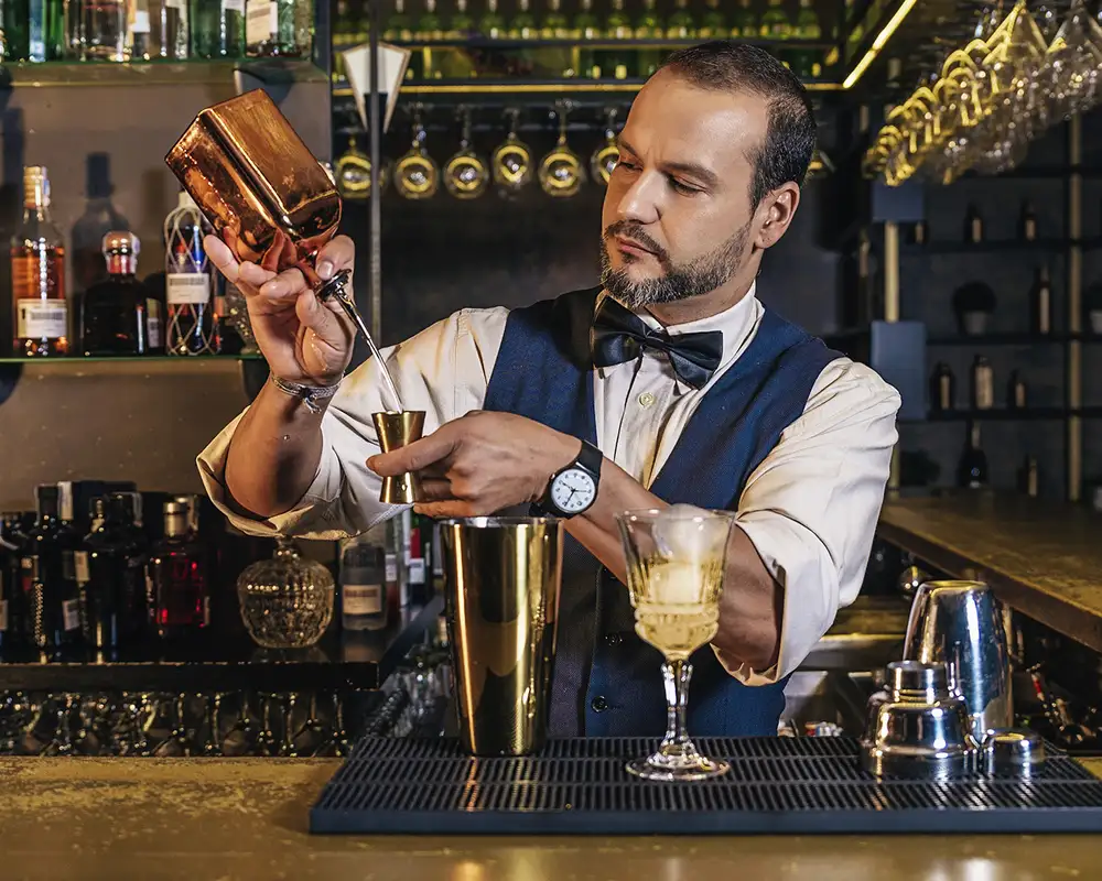 A bartender making a drink