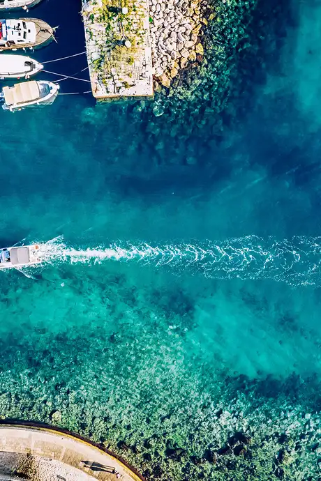 A Boat sailing through the crystal clear waters around Dubrovnik