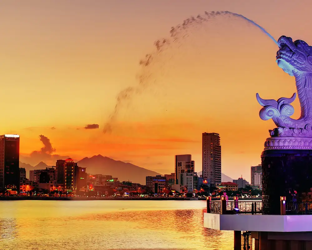 A landscape image of Singapore with a statue