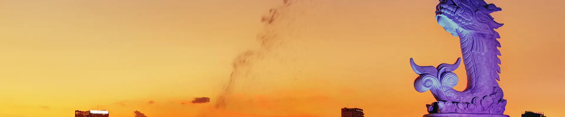 A landscape image of Singapore with a statue