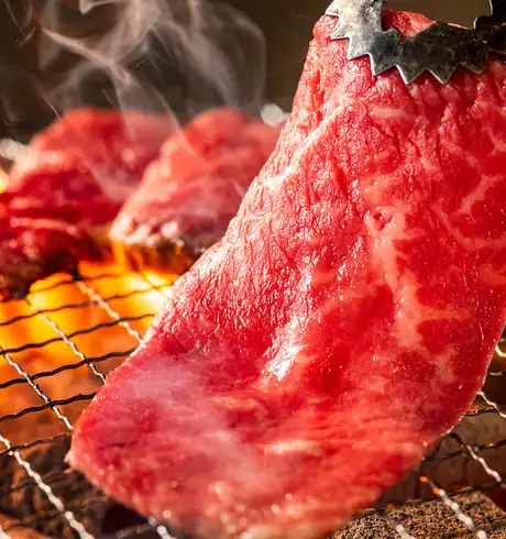 A Steak being cooked on a grill