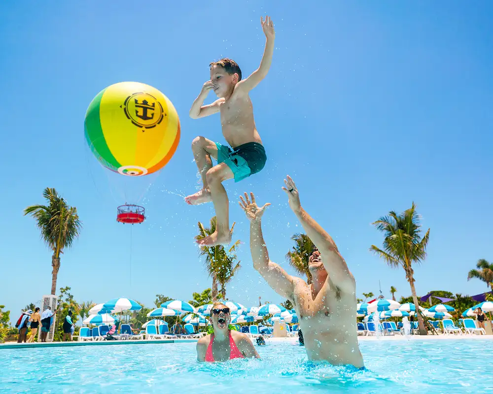 A family having fun in a pool in Cococay