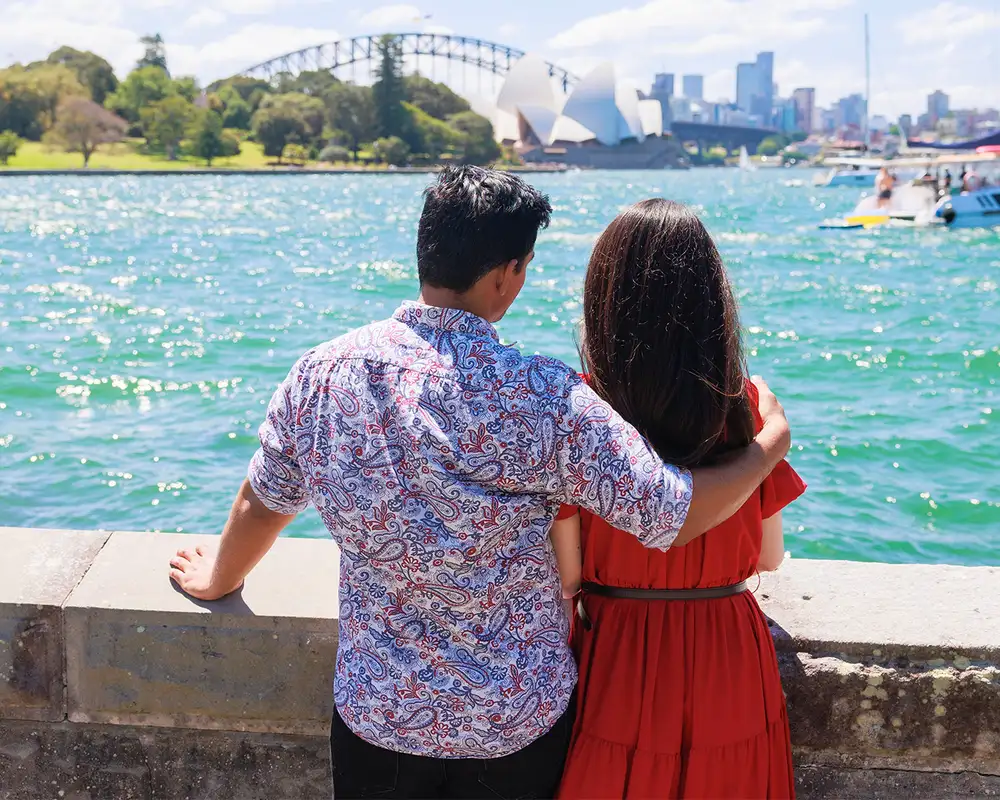 A couple looking out at Sydney Harbour