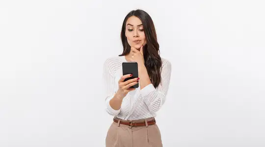 A Woman Looking confused at her phone