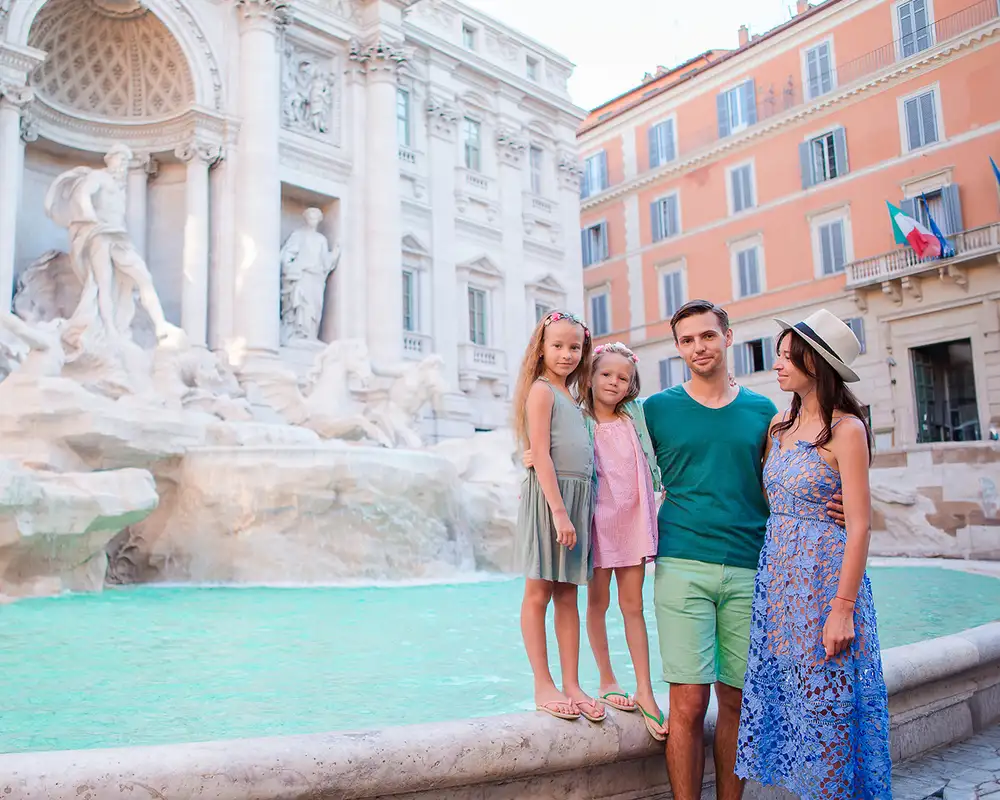 A Family in Rome infront of Trevi Fountain