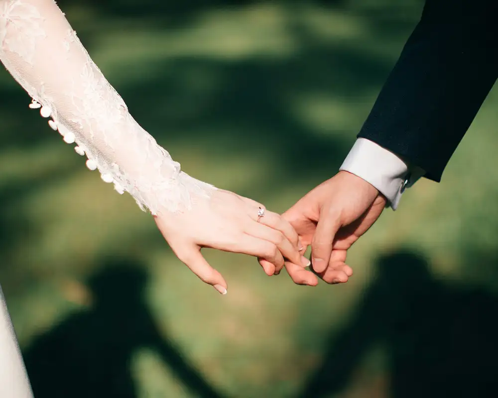 A couples hands on their wedding day