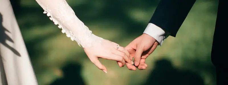 A couples hands on their wedding day
