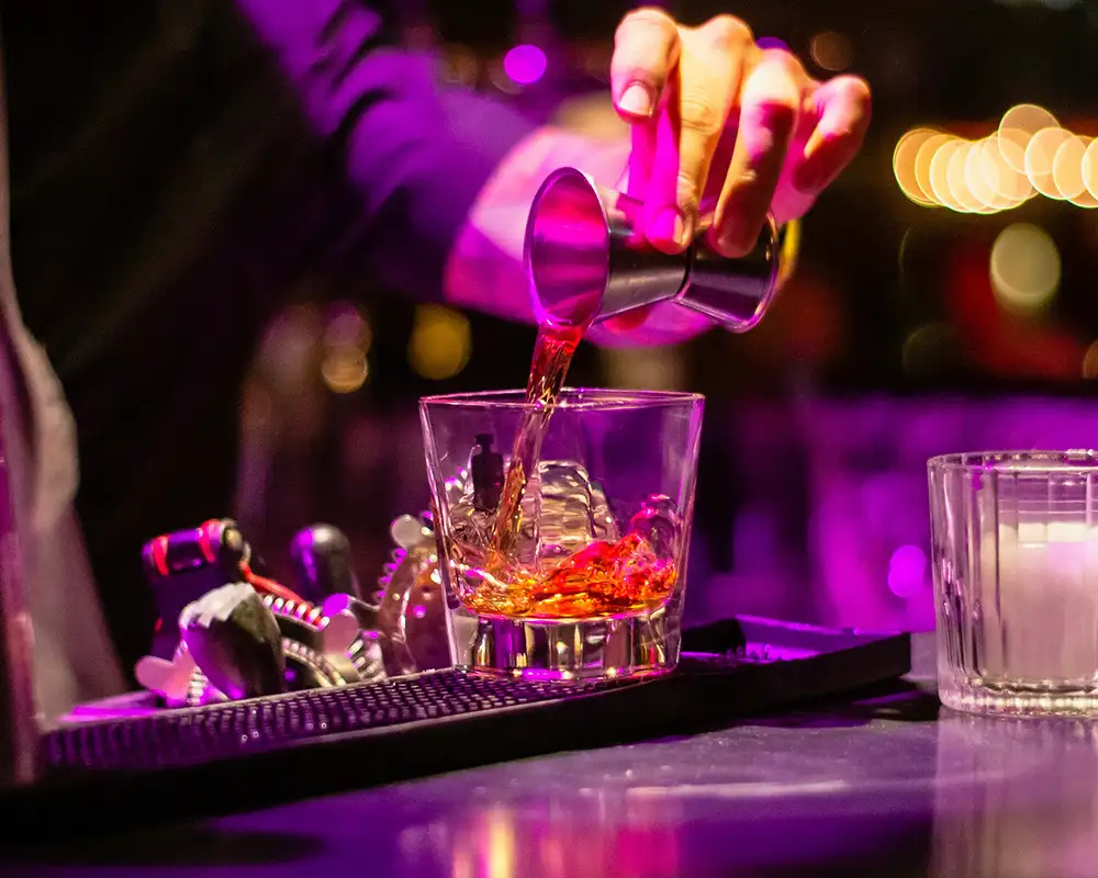 A bartender making a drink