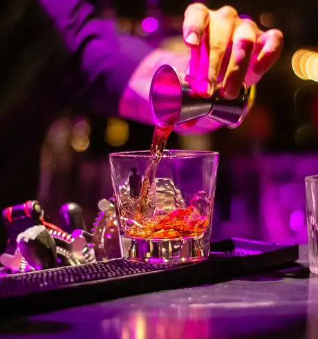 A bartender making a drink