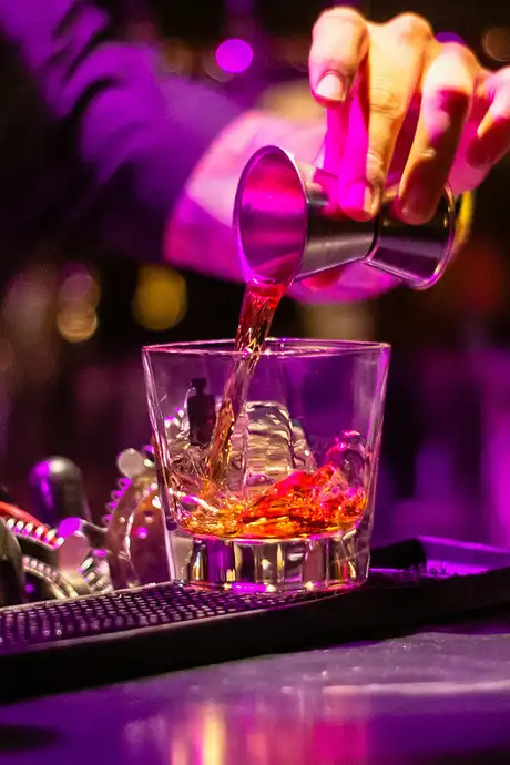 A bartender making a drink
