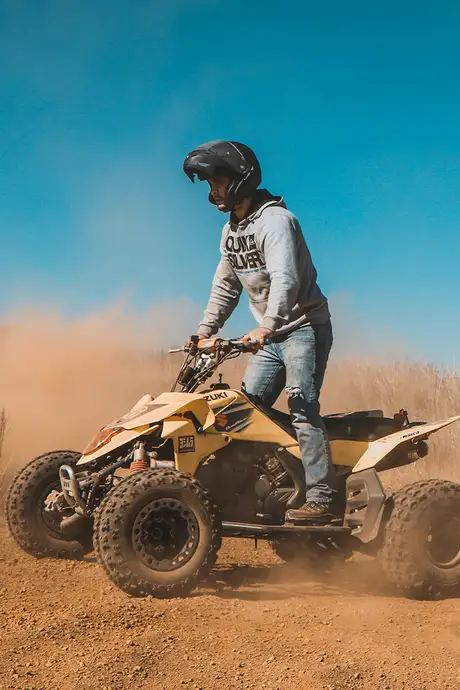 A Man Riding a Quad Bike