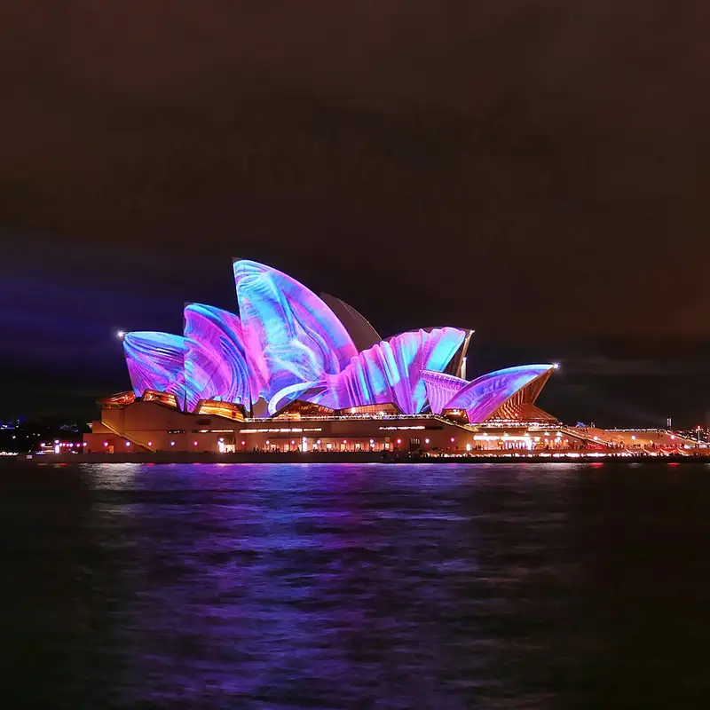 Sydney Opera House lit up at night