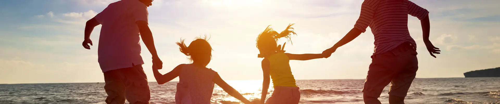 A Family at the beach at sunset