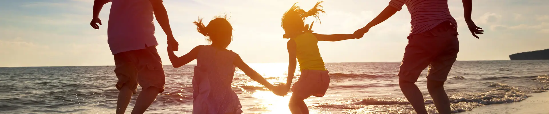 A Family at the beach at sunset