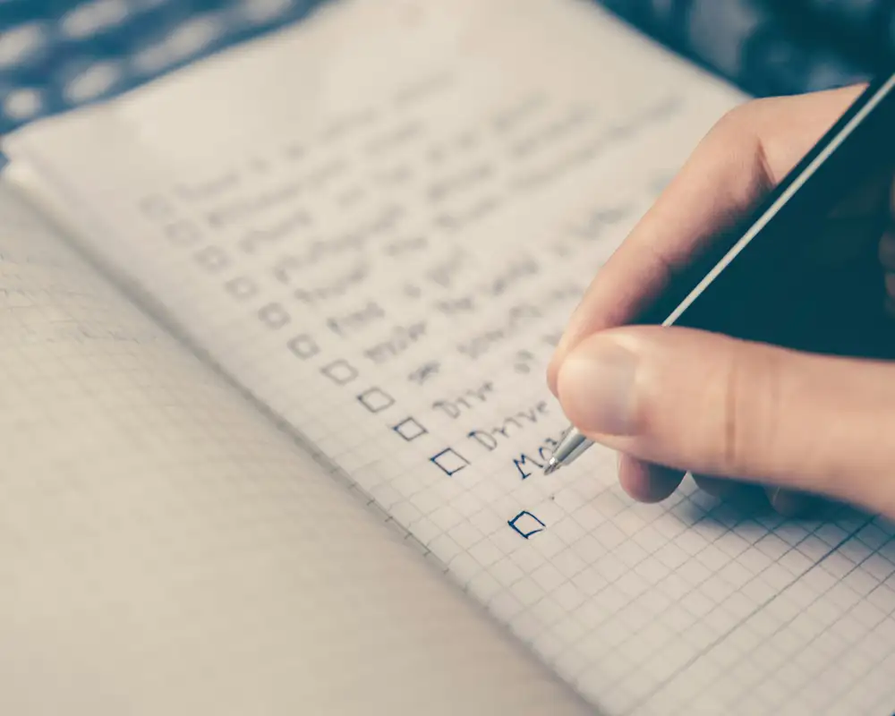A Person writing a Todo List