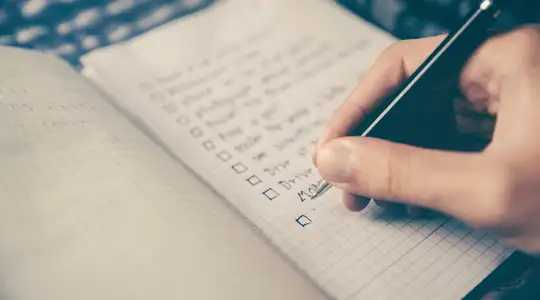 A Person writing a Todo List