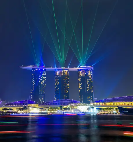 The Marina Bay Sands building in Singapore lit up at night